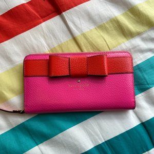 kate spade zip around wallet in hot pink and orange leather with classic bow
